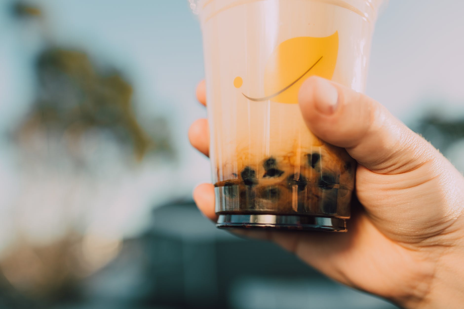 woman holding bubble tea cup
