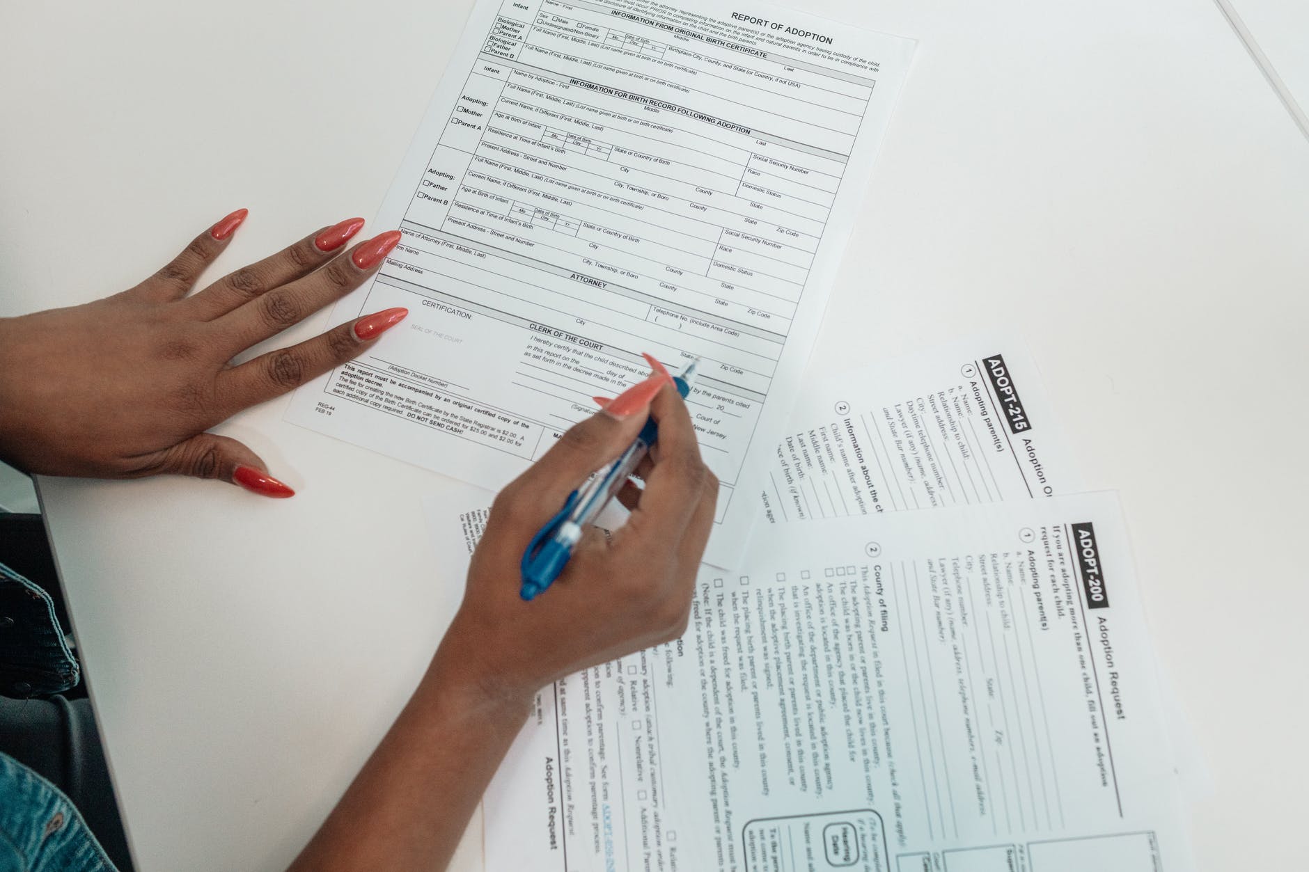 a person filling out adoption request documents