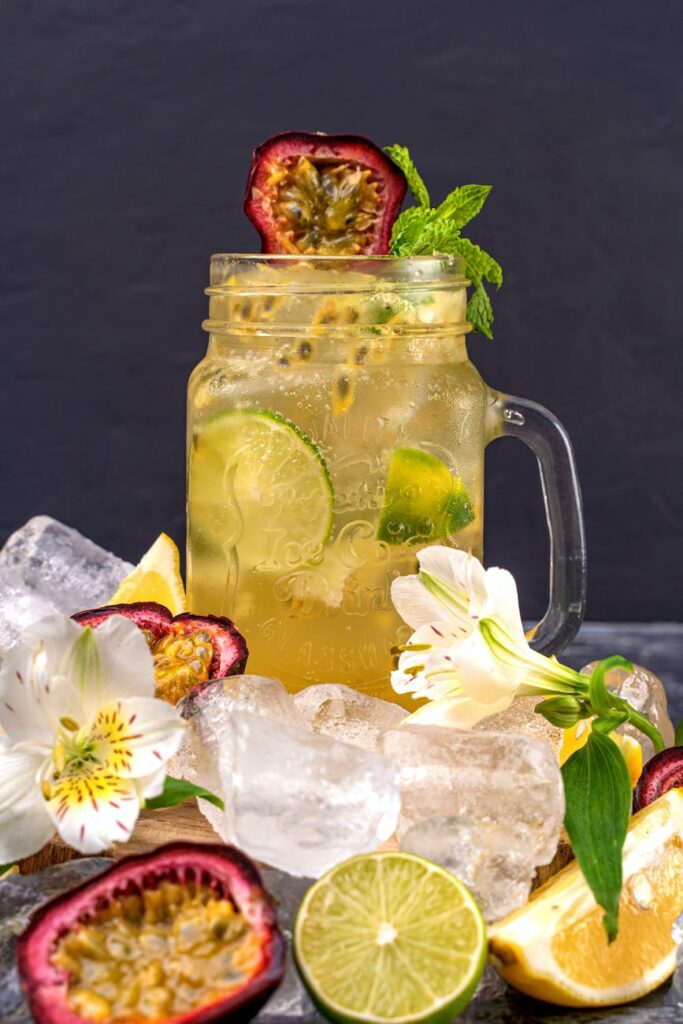 sliced lime and passion fruit on an ice cold drink