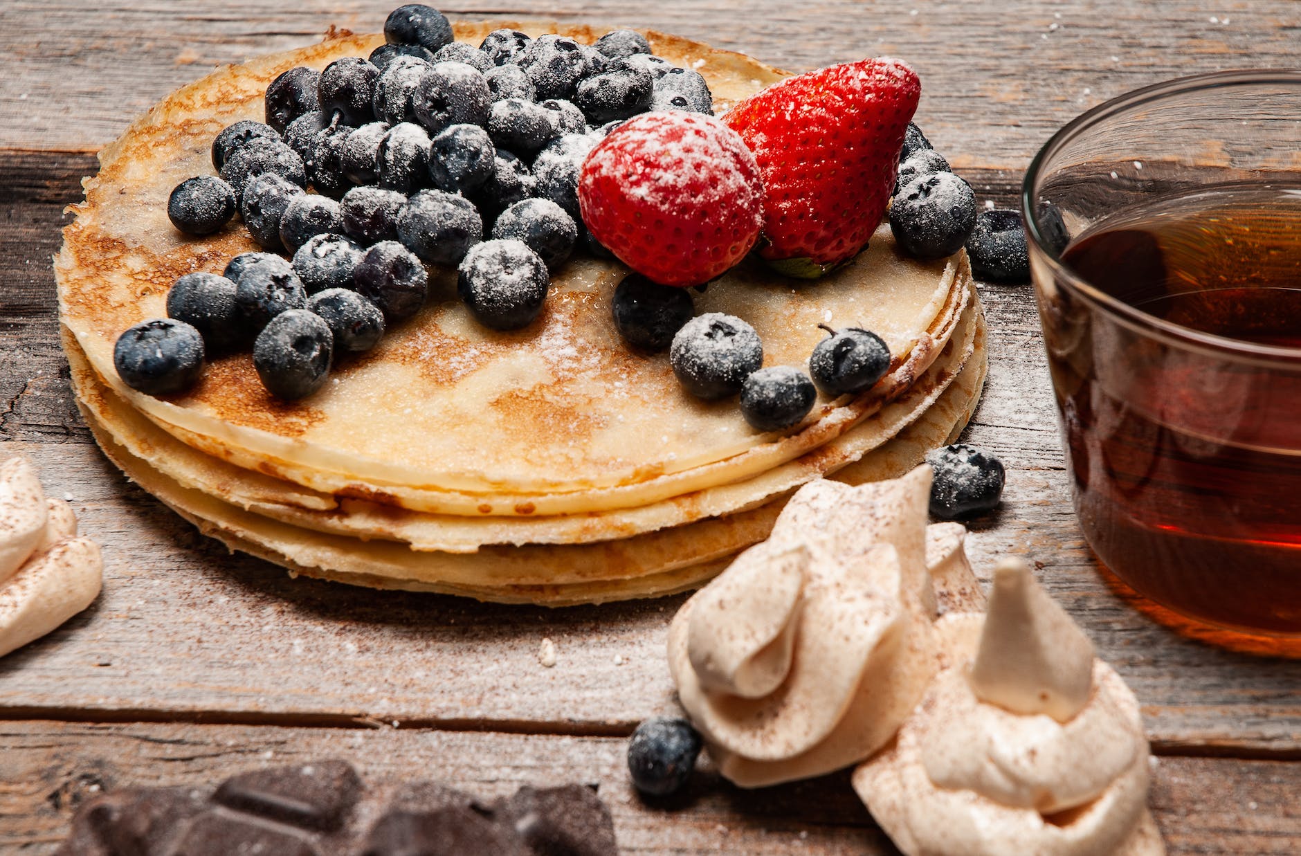 pancakes with strawberries and blueberries on top Photo by Dmytro on Pexels.com